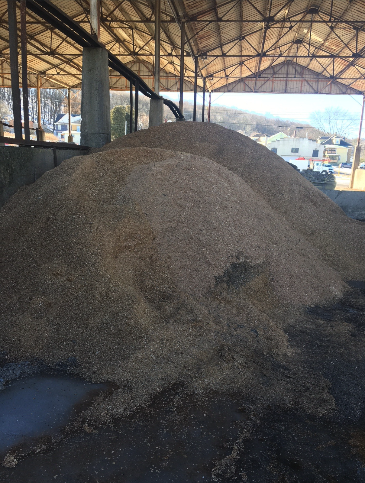 Sawdust stored in a covered shed at Kindle Firewood Co.